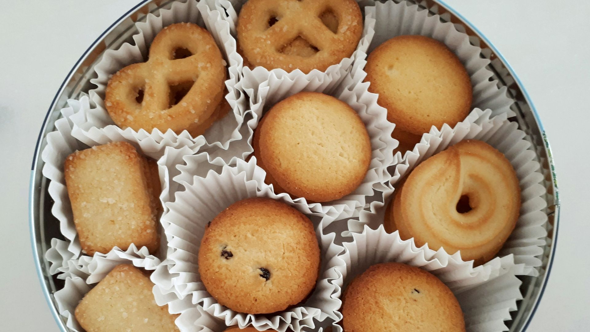 brown and white donuts on white ceramic plate