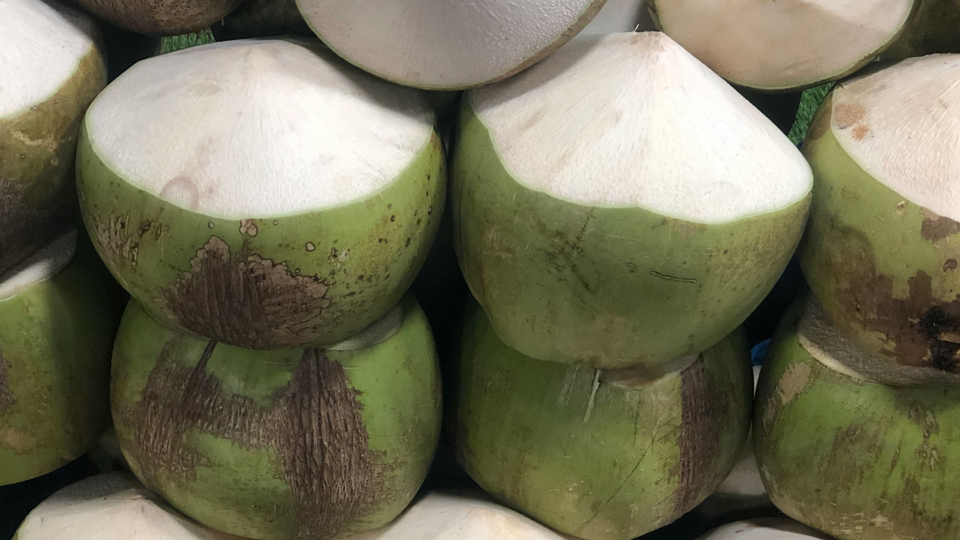 a pile of coconuts sitting on top of each other