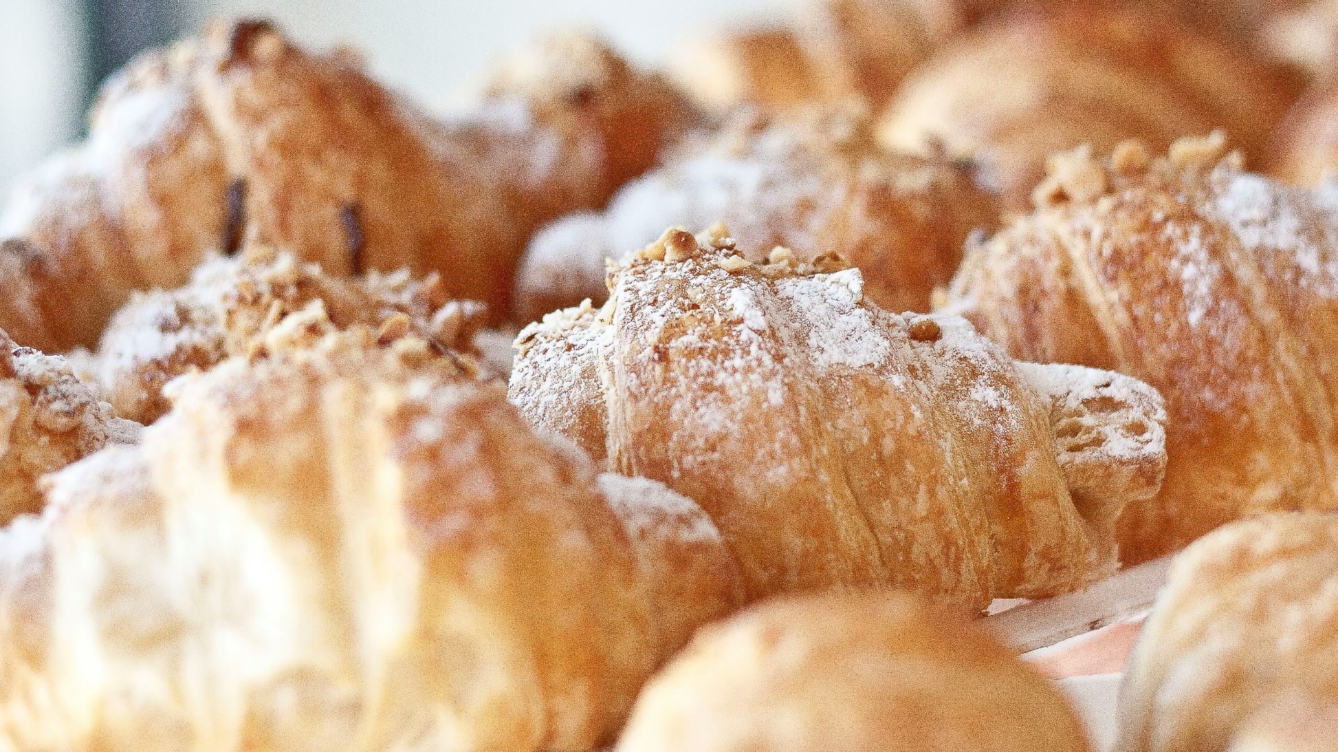 a bunch of croissants that are sitting on a table