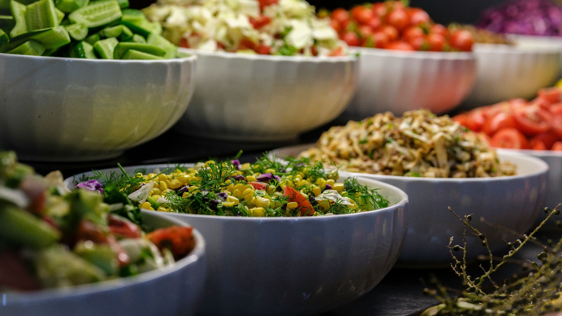 a group of bowls full of food