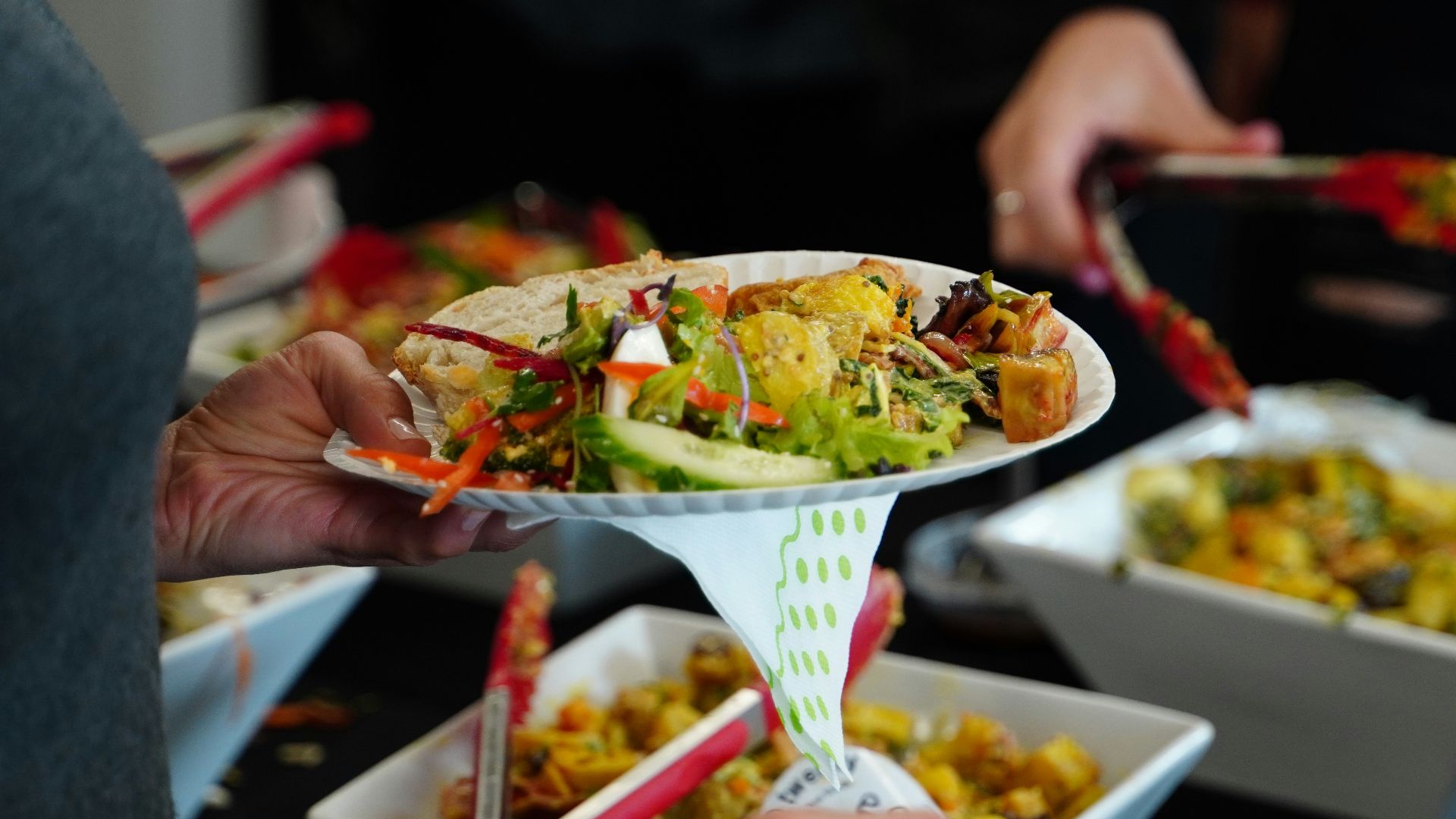 person holding white ceramic bowl with food