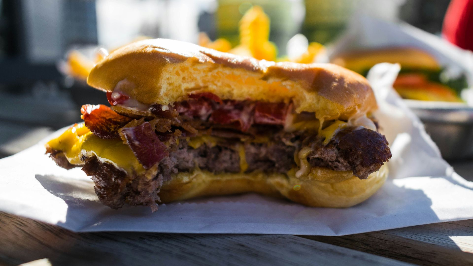 close-up photography of hambuger on white textile