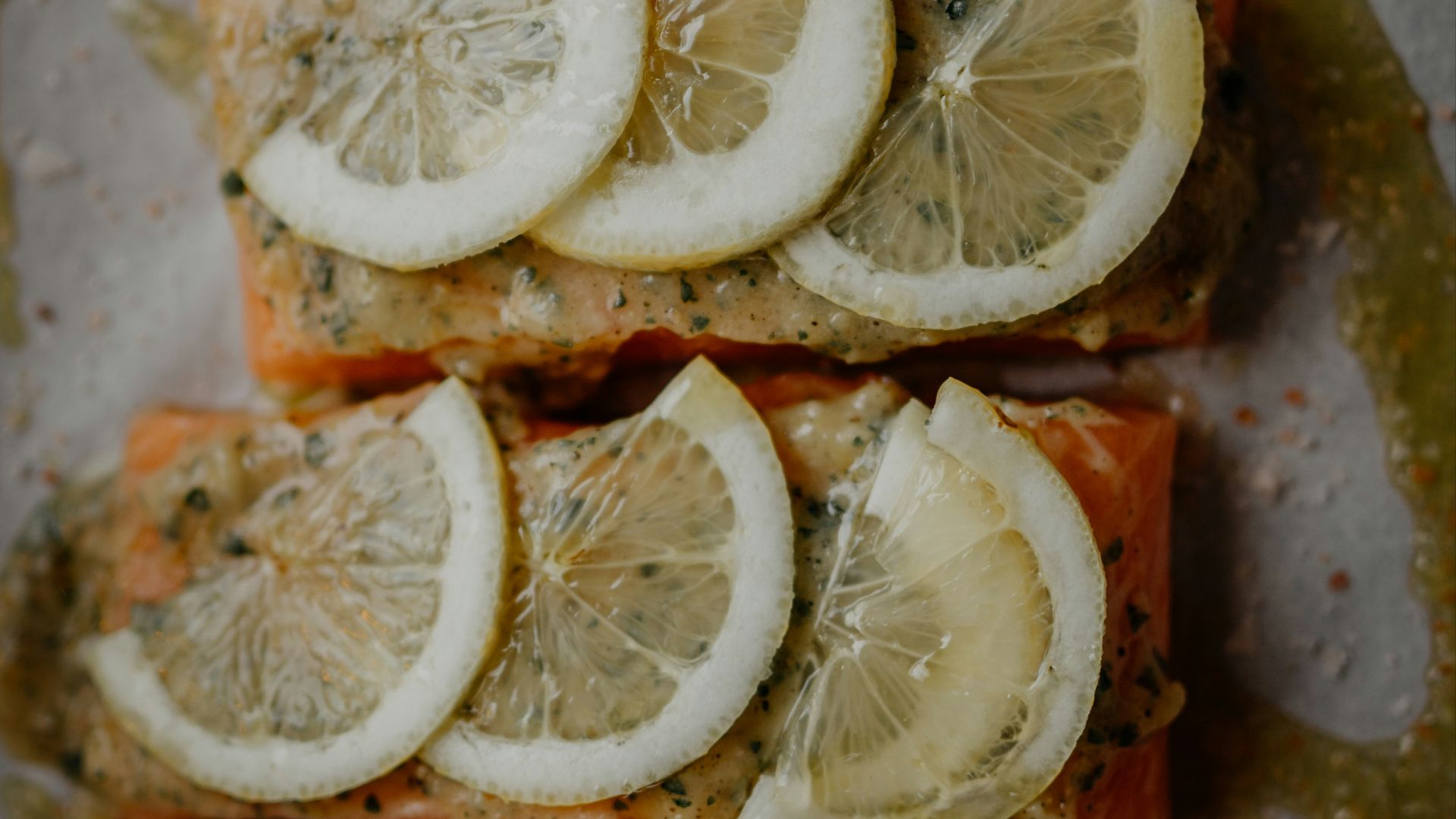 sliced of pizza with sliced lemon