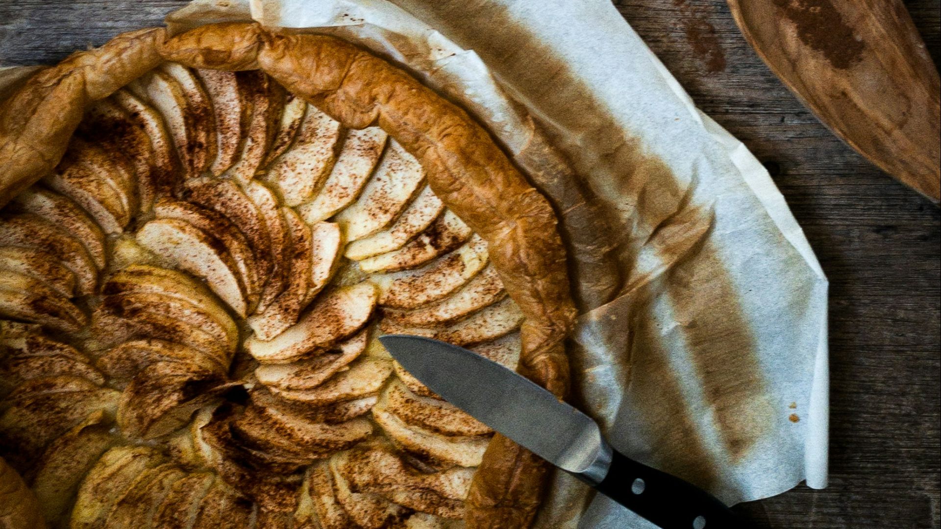 stainless steel mug with brown liquid on white textile