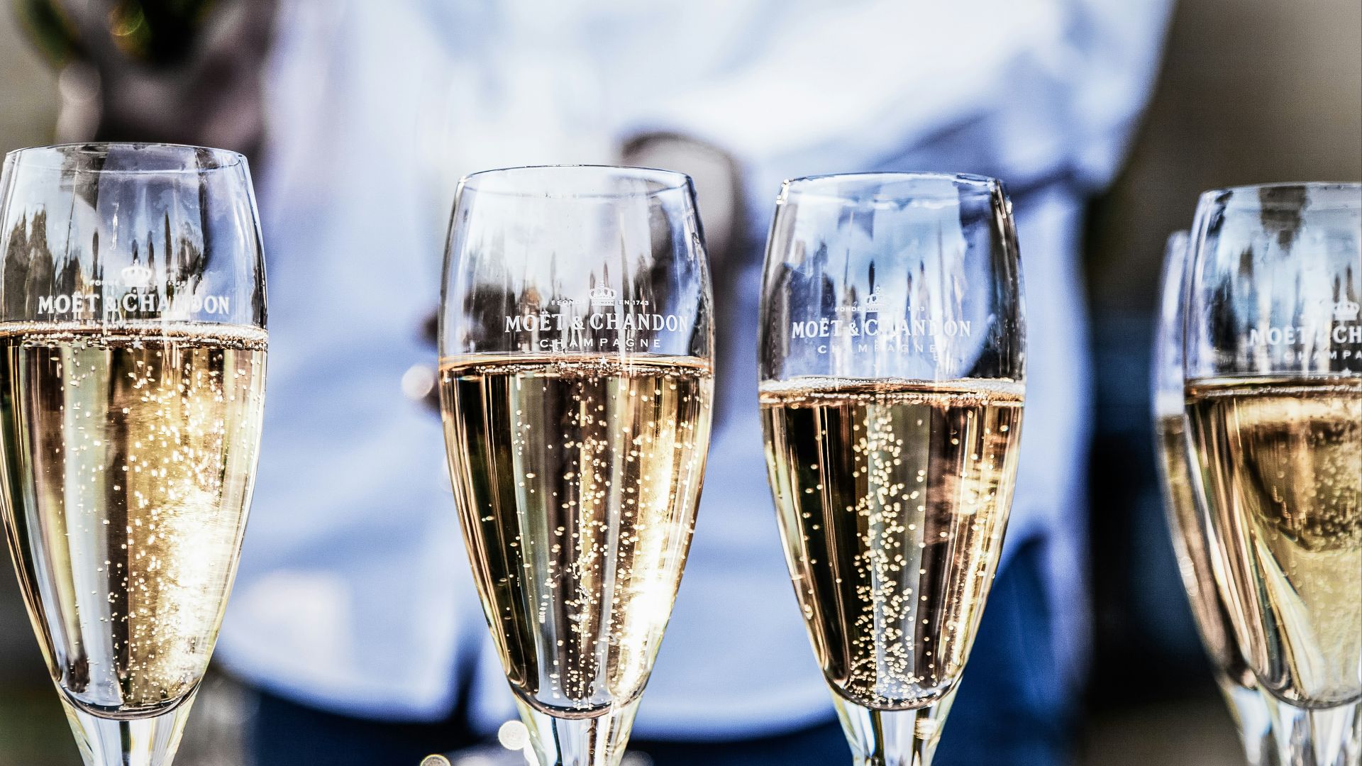 four clear champagne flutes