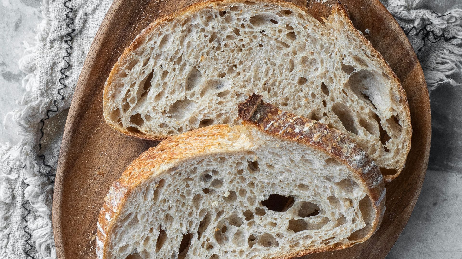bread on brown wooden round tray