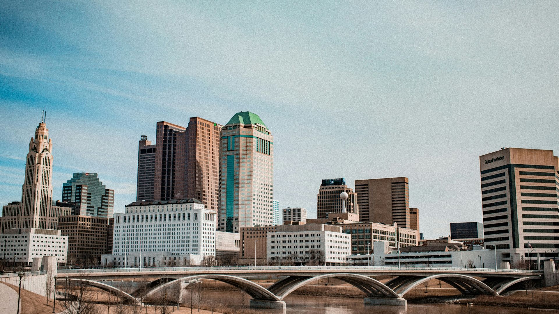 view of bridge and high-rise buildings at daytime