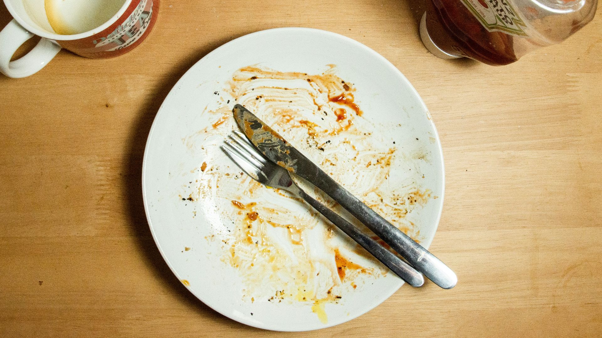 stainless steel fork and knife on white ceramic plate