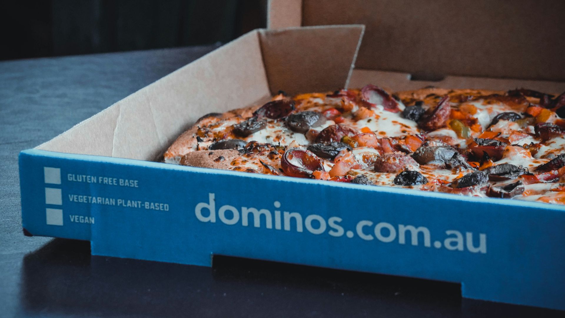 a blue box with a pizza inside of it