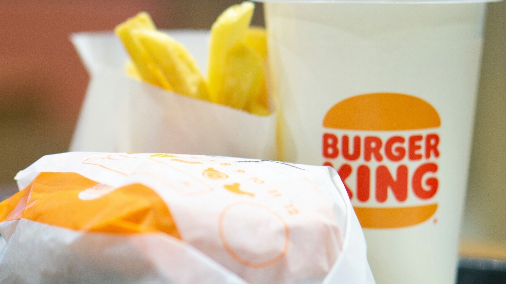 a plate with a sandwich and a cup of coffee