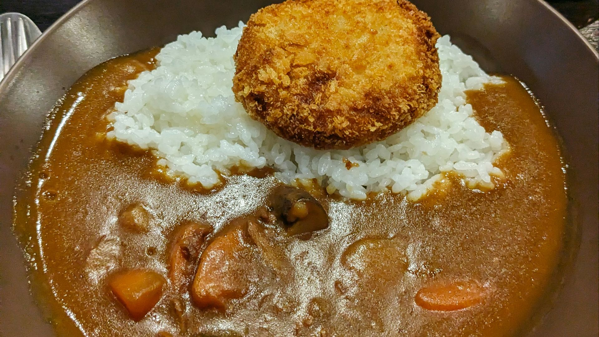 a plate of food with rice and meat