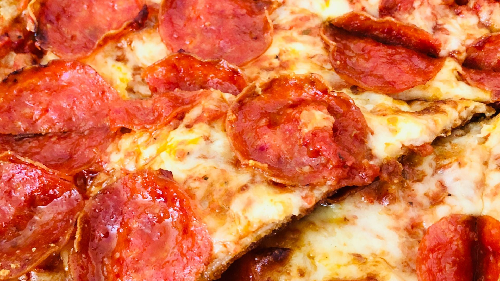 pepperoni pizza on white ceramic plate