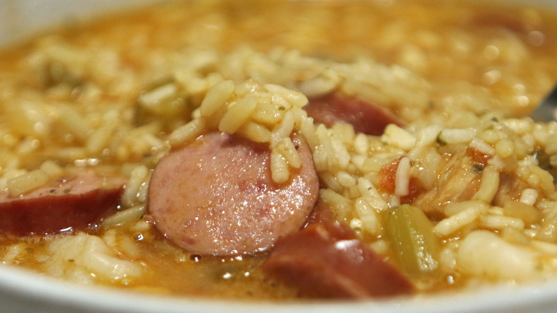 a bowl of soup with a spoon in it
