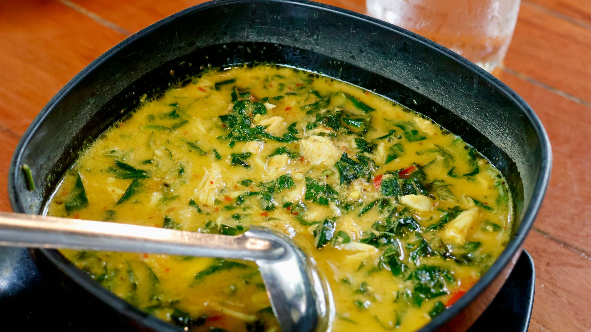 a bowl of soup with a spoon in it