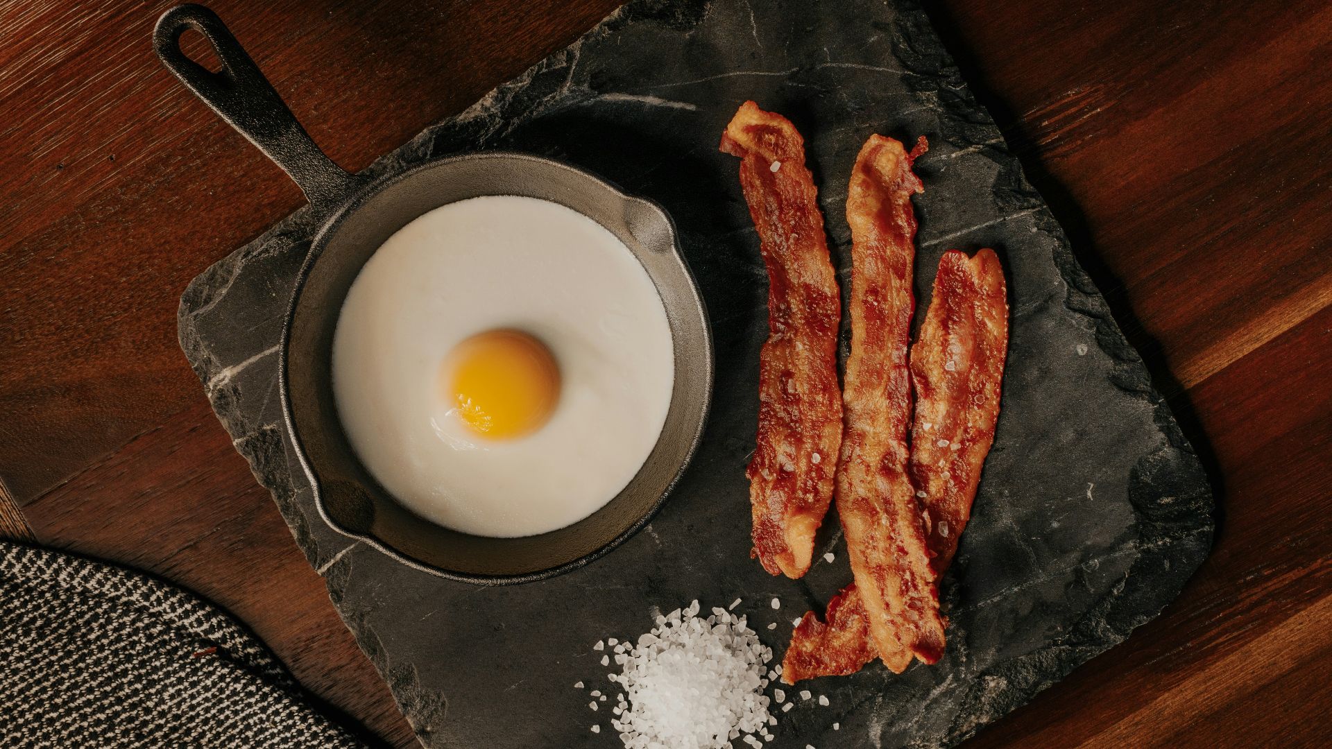 white egg on black plate