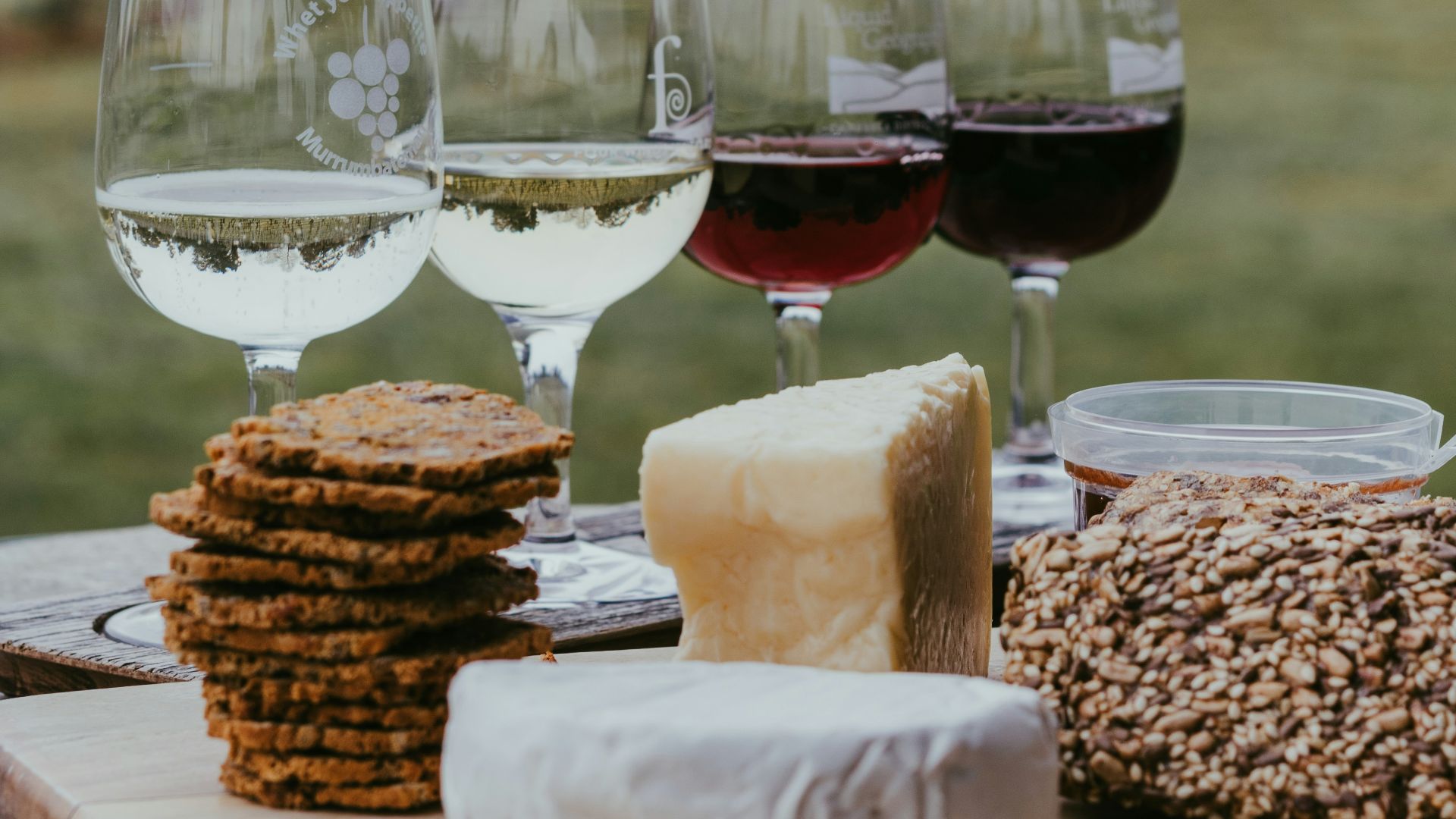clear wine glass with red wine on table