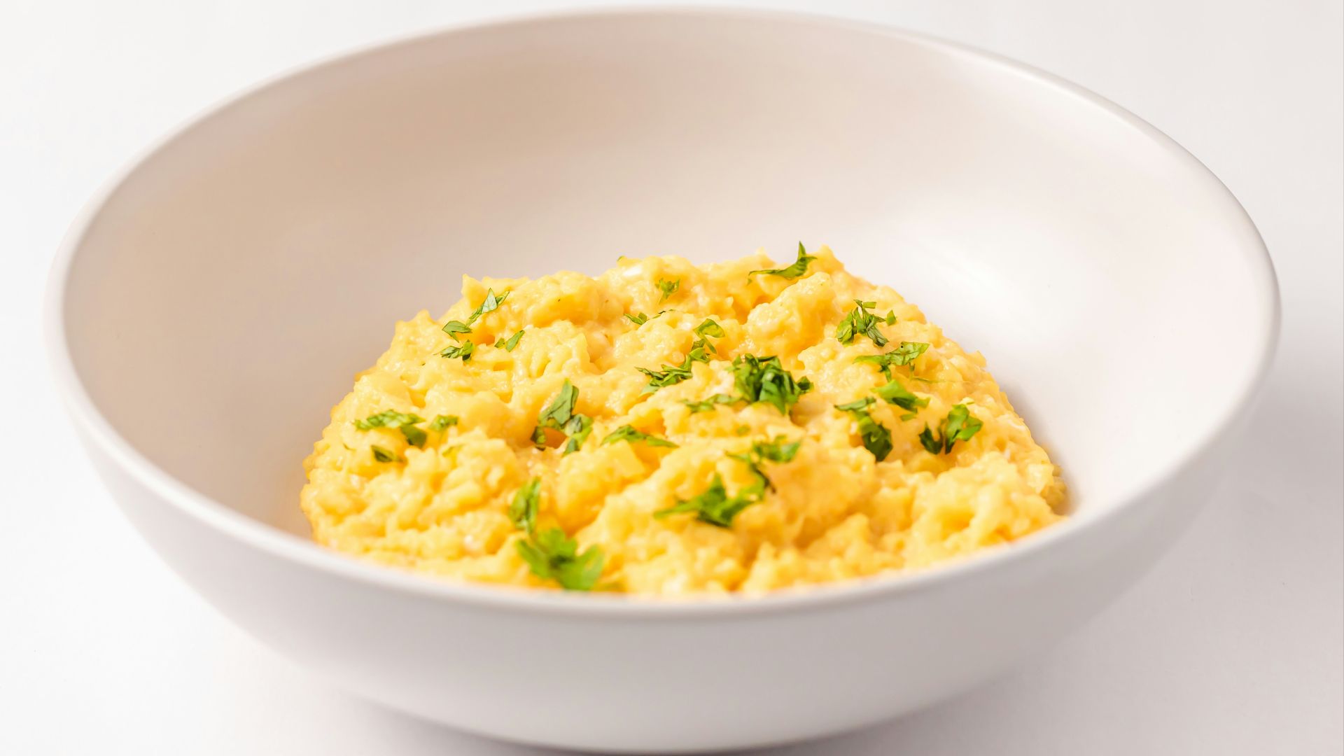 a close up of a bowl of food on a table
