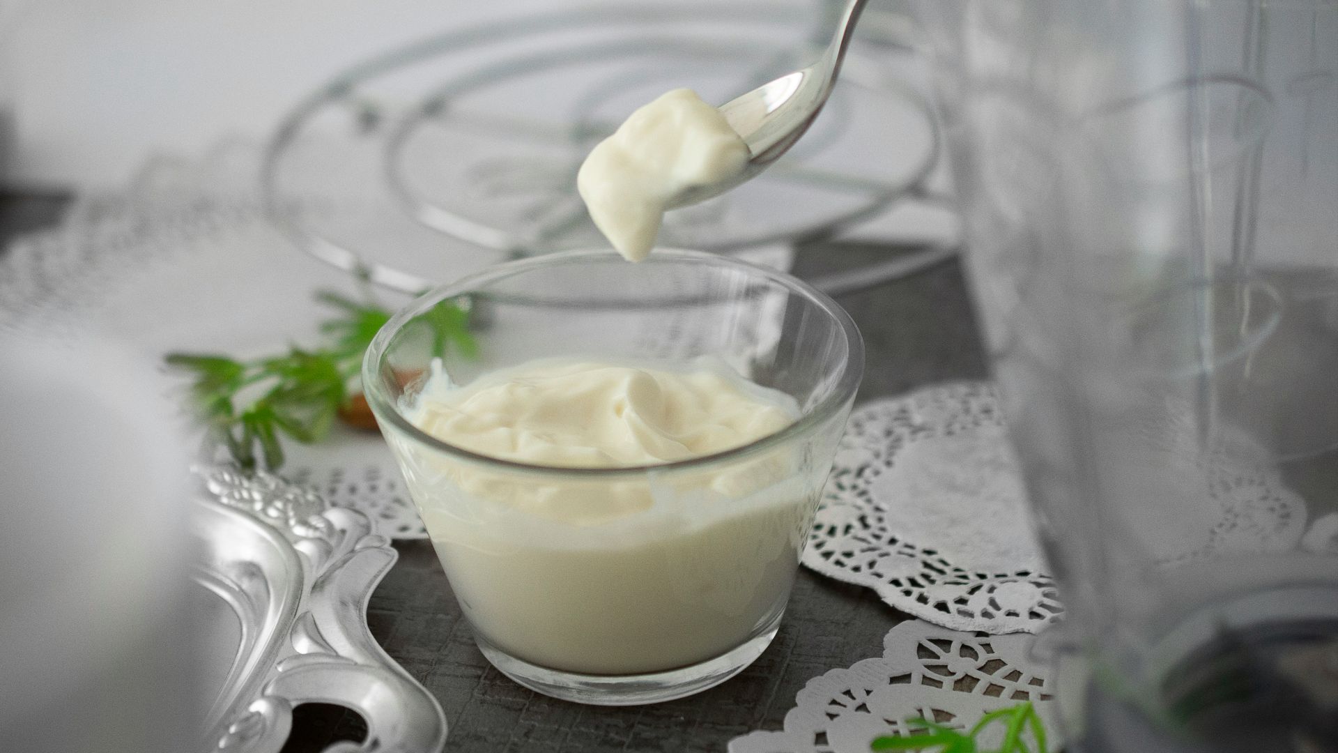 close-up photo of white cream in clear shot glass