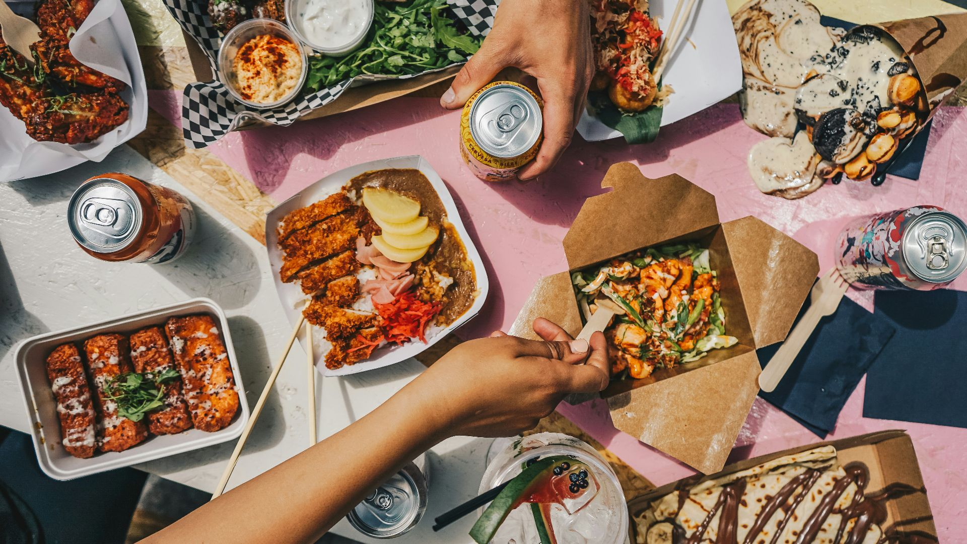 a group of people sitting around a table eating food