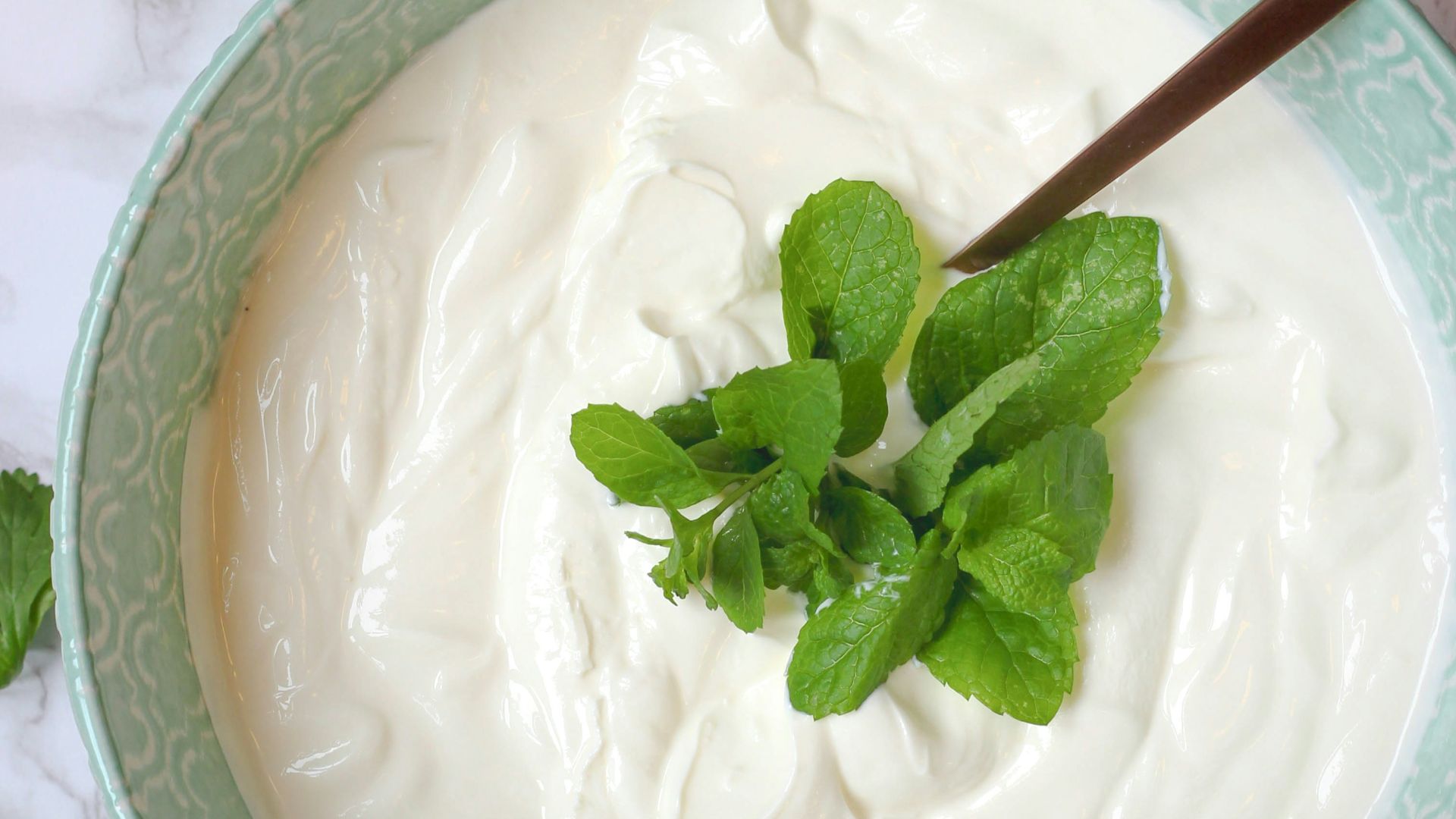 a bowl of yogurt with a spoon in it