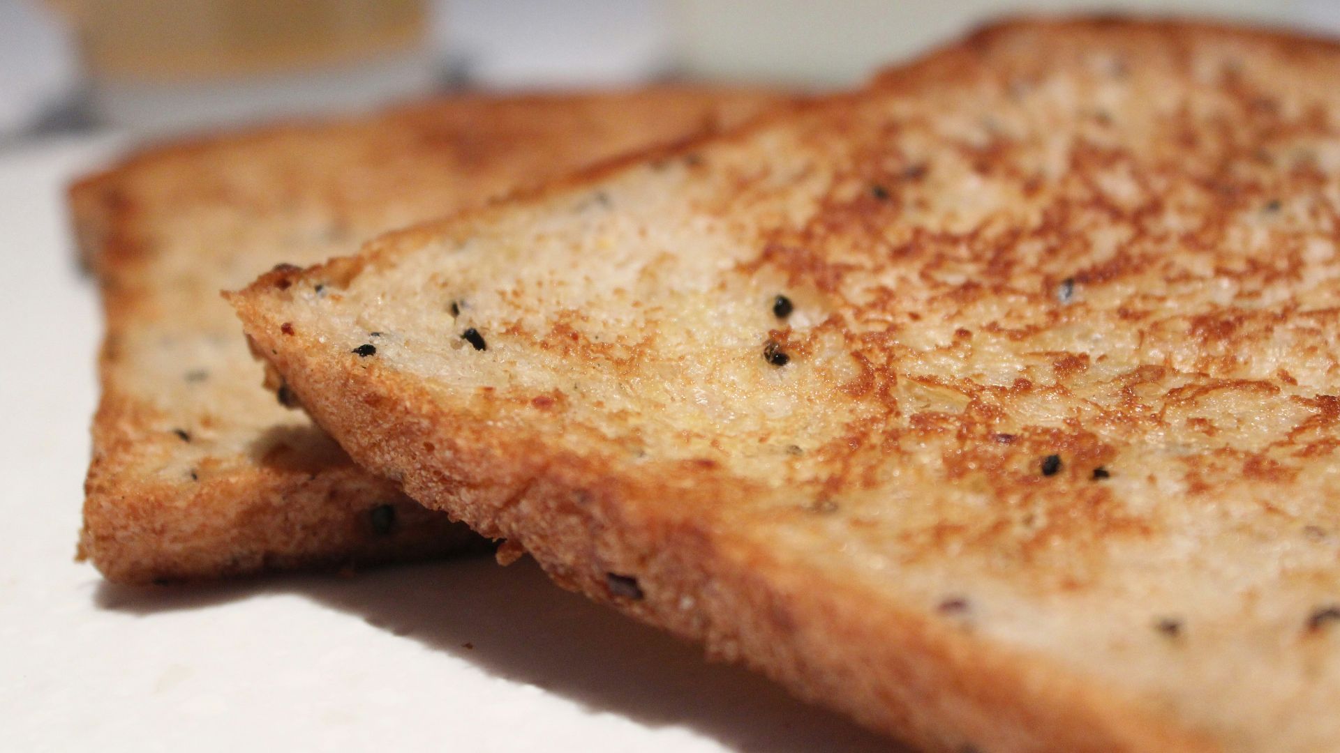 a close up of a grilled cheese sandwich on a plate