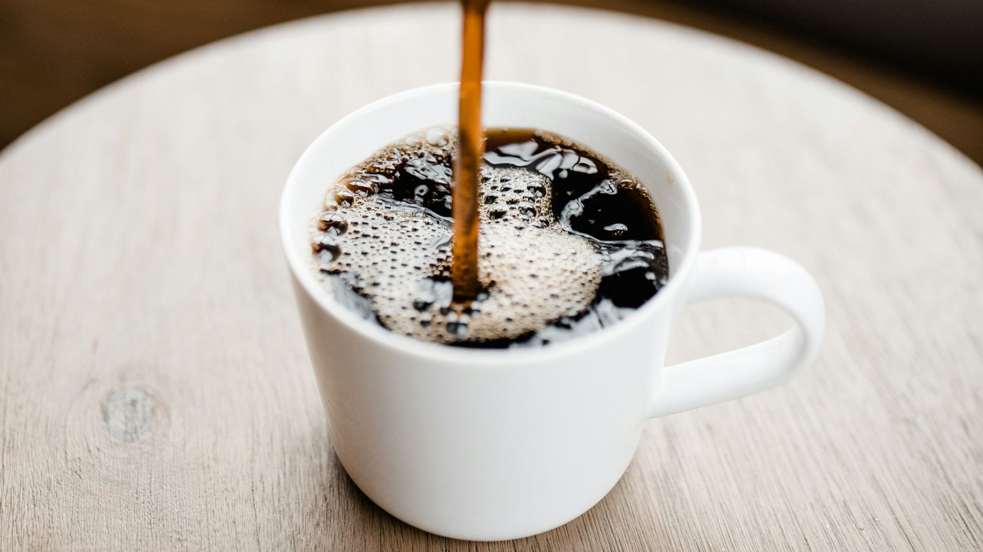 white ceramic mug with coffee