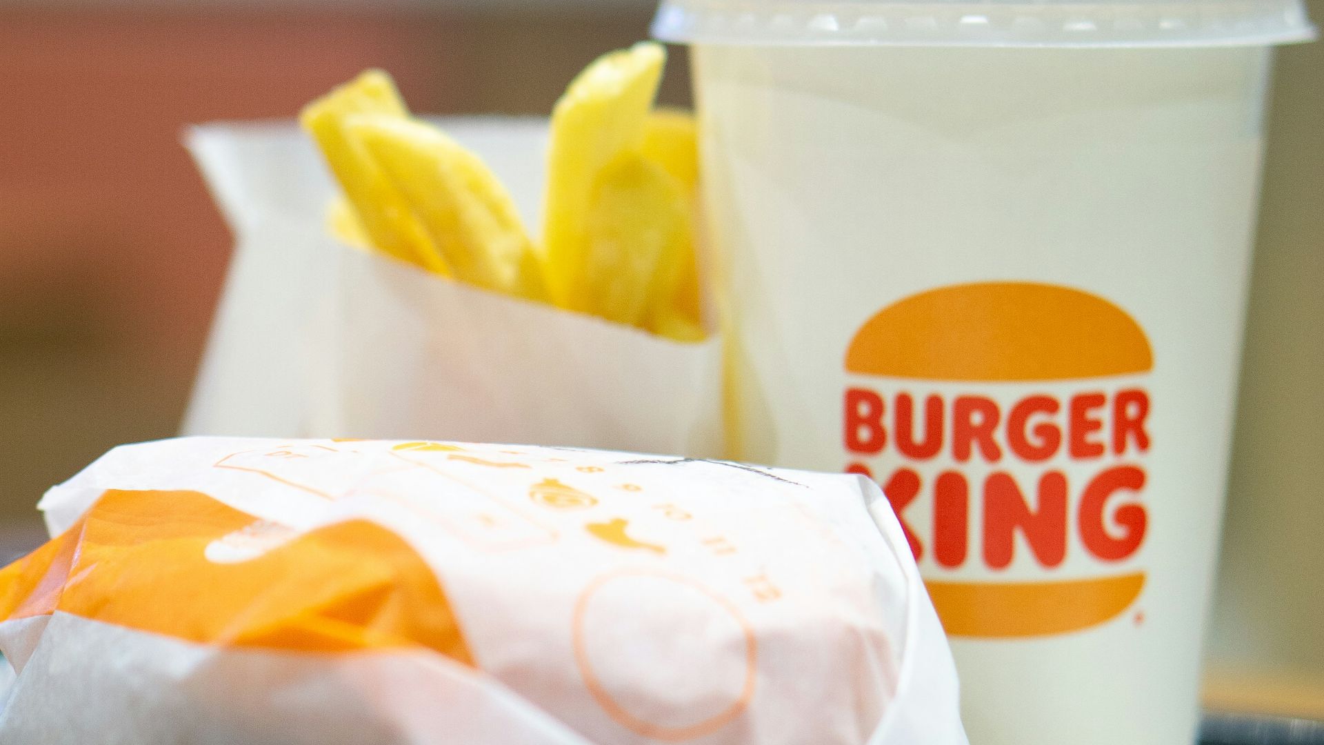 a plate with a sandwich and a cup of coffee