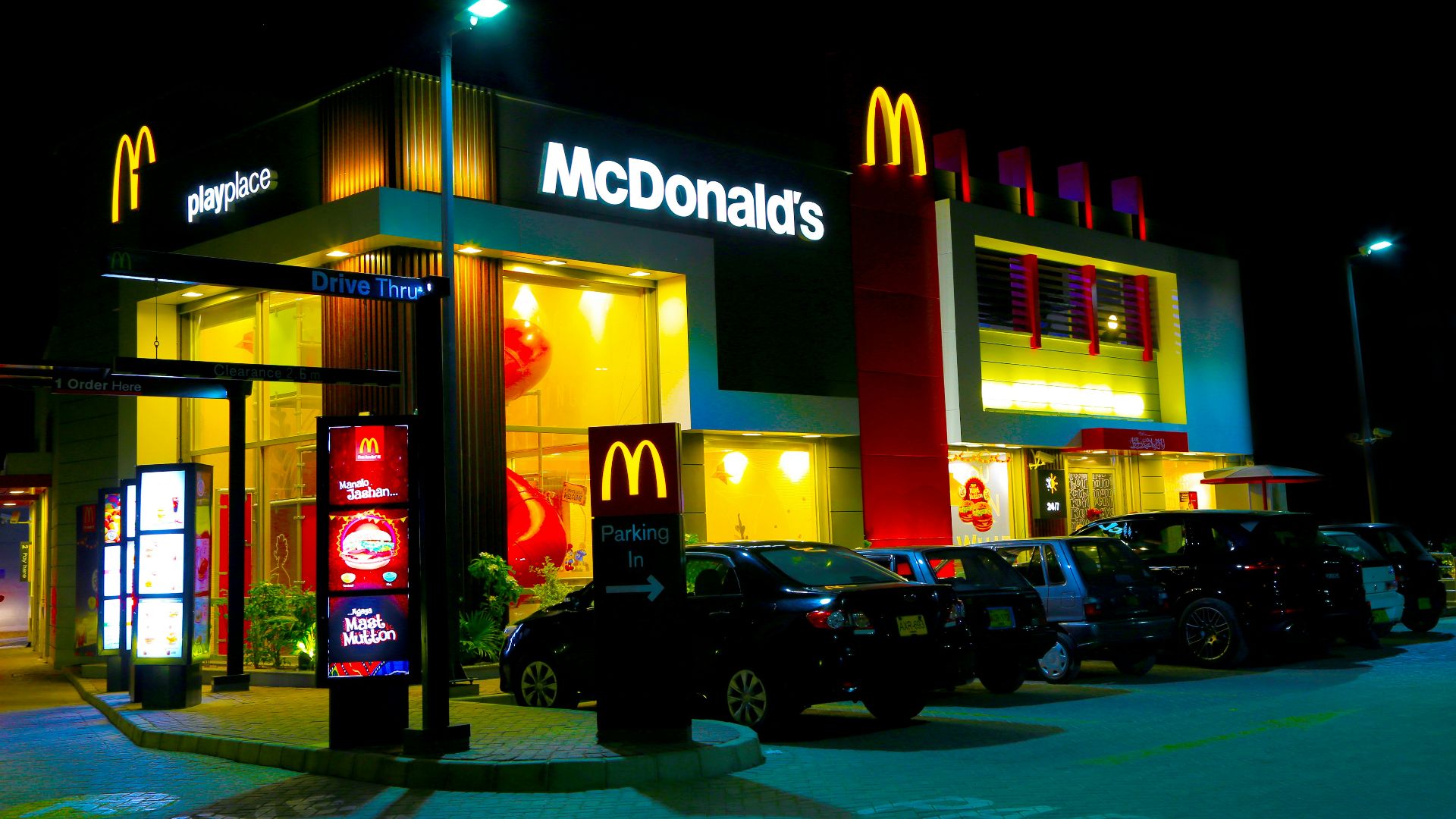 cars parked in front of UNKs restaurant during night time