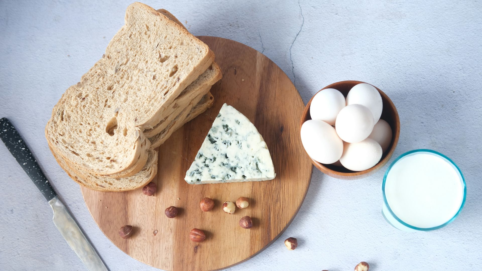 sliced bread on brown wooden chopping board