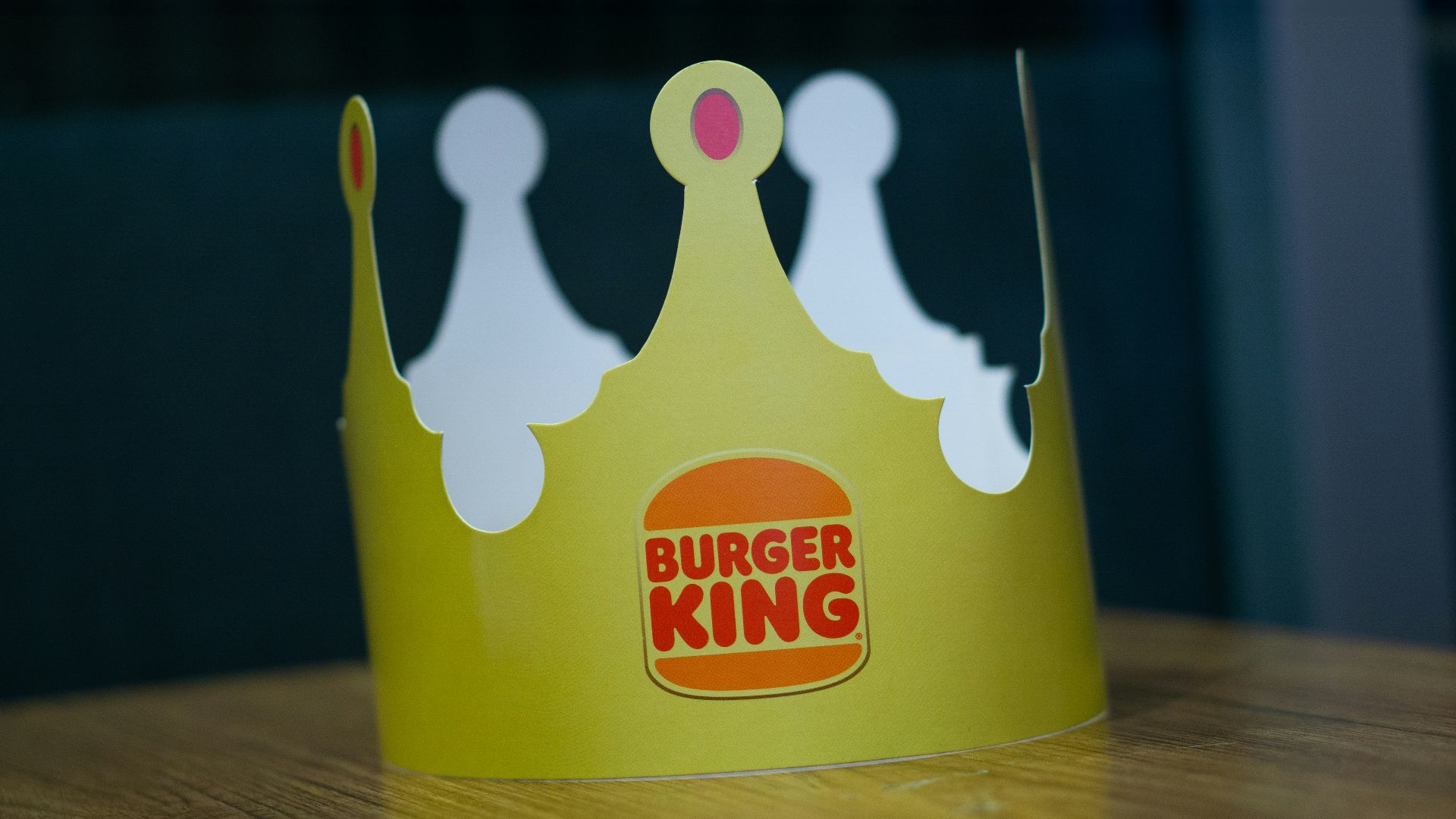 a paper crown sitting on top of a wooden table
