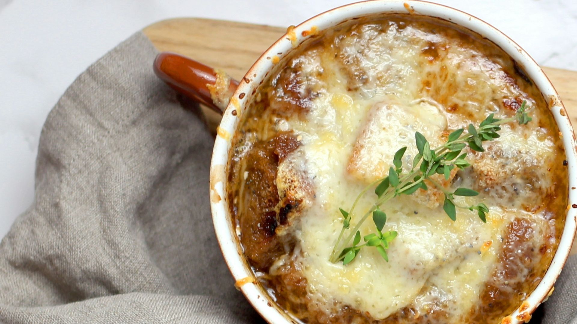 soup with green leaf in teacup
