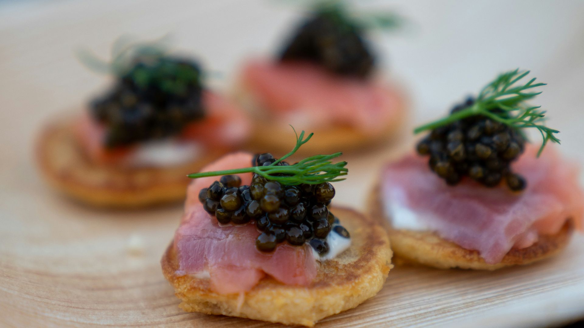 brown bread with green leaves on white ceramic plate