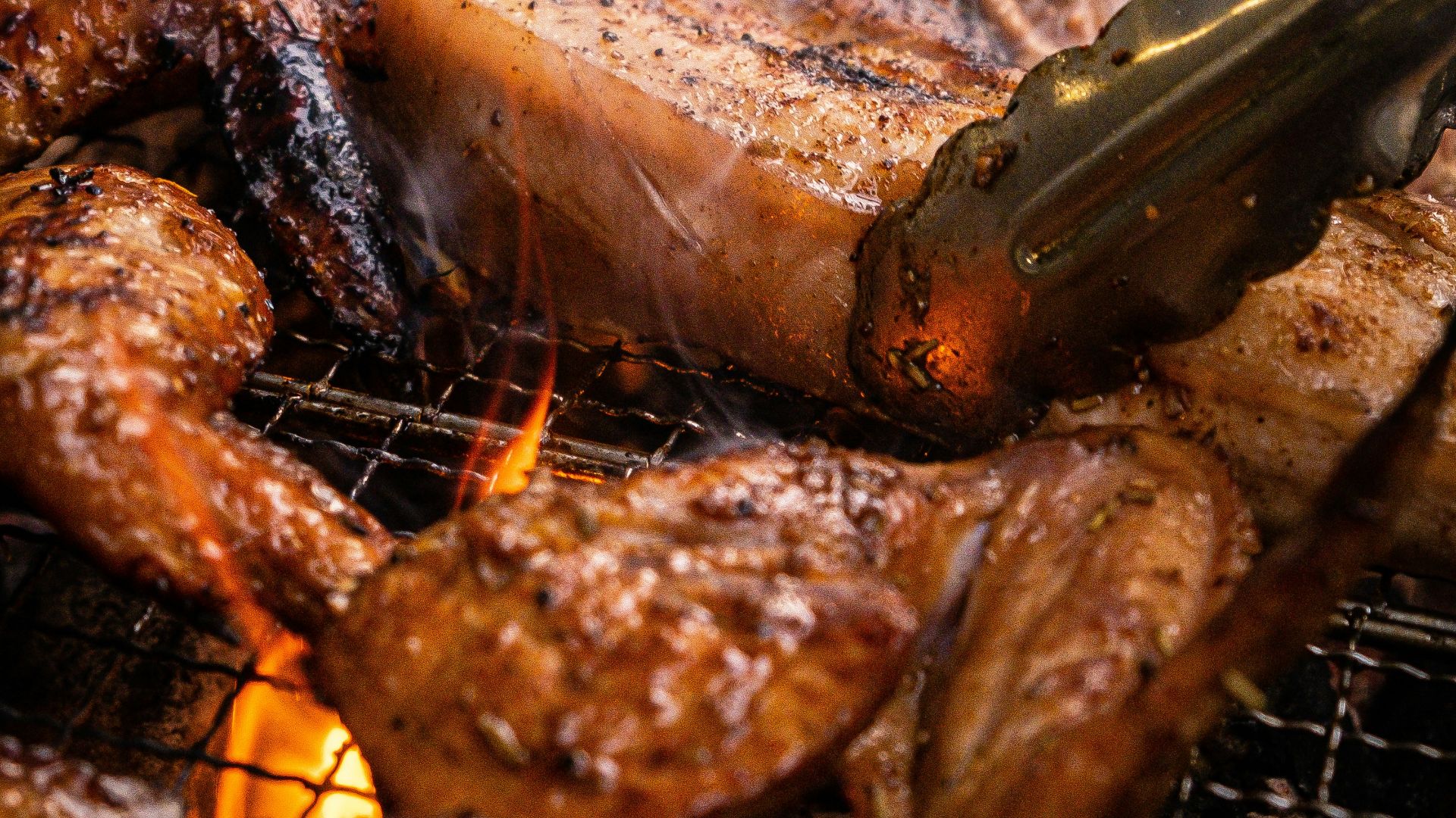 grilled meat on charcoal grill