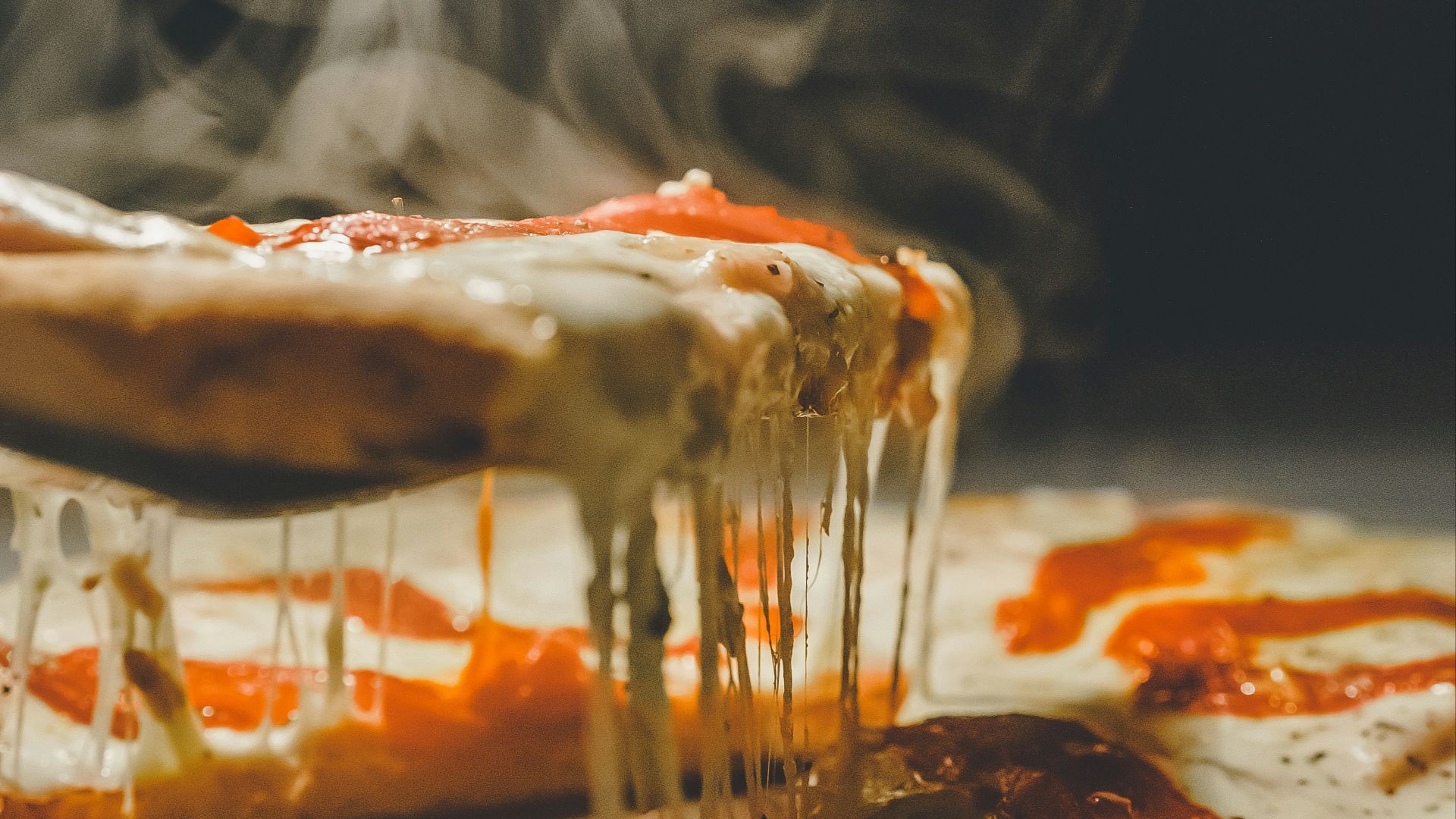 close up photo of pizza with cheese