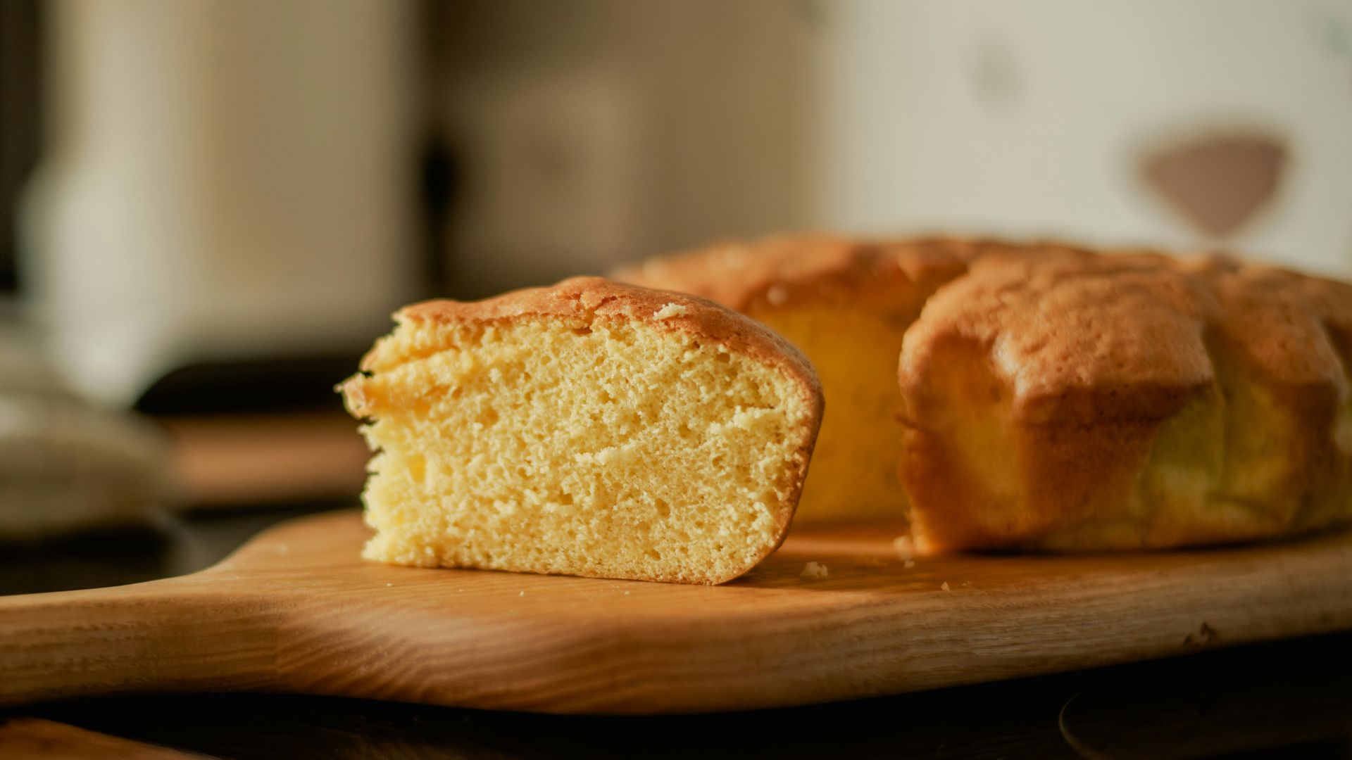 A loaf of bread sitting on top of a wooden cutting board