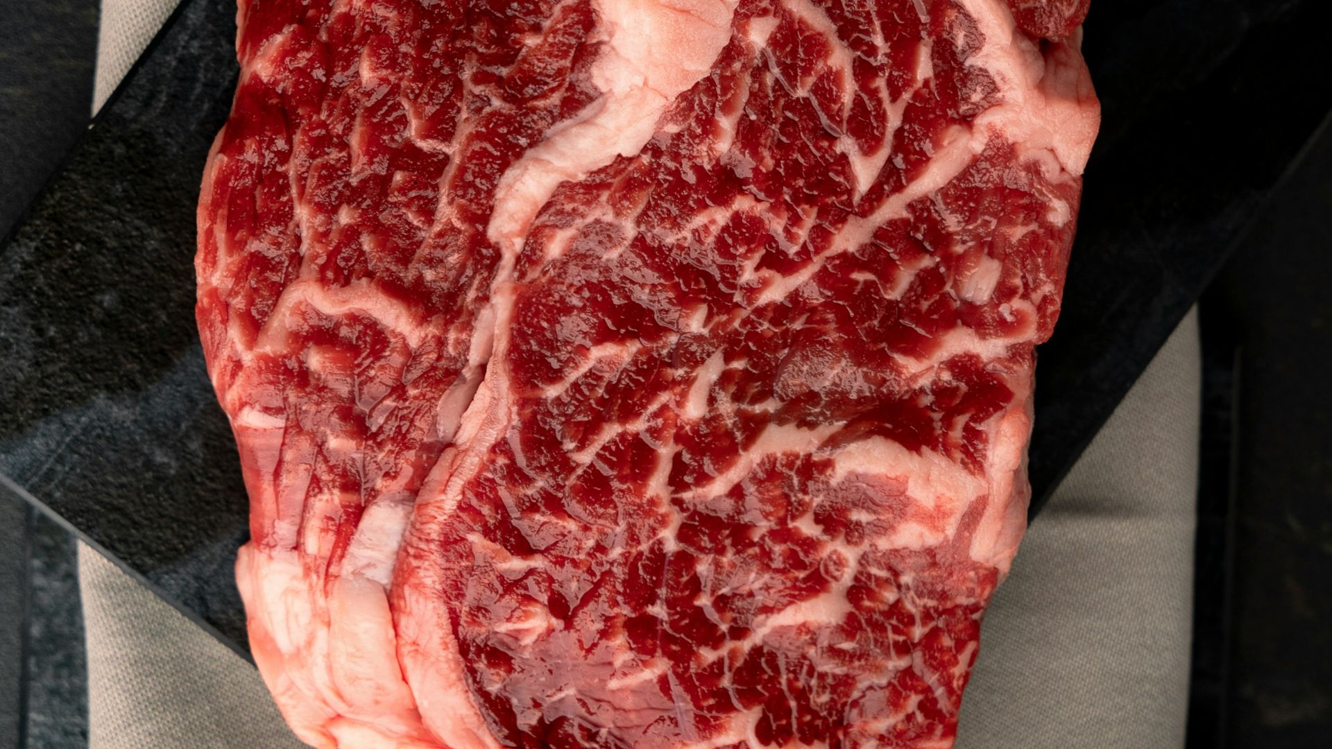 A piece of meat sitting on top of a piece of paper