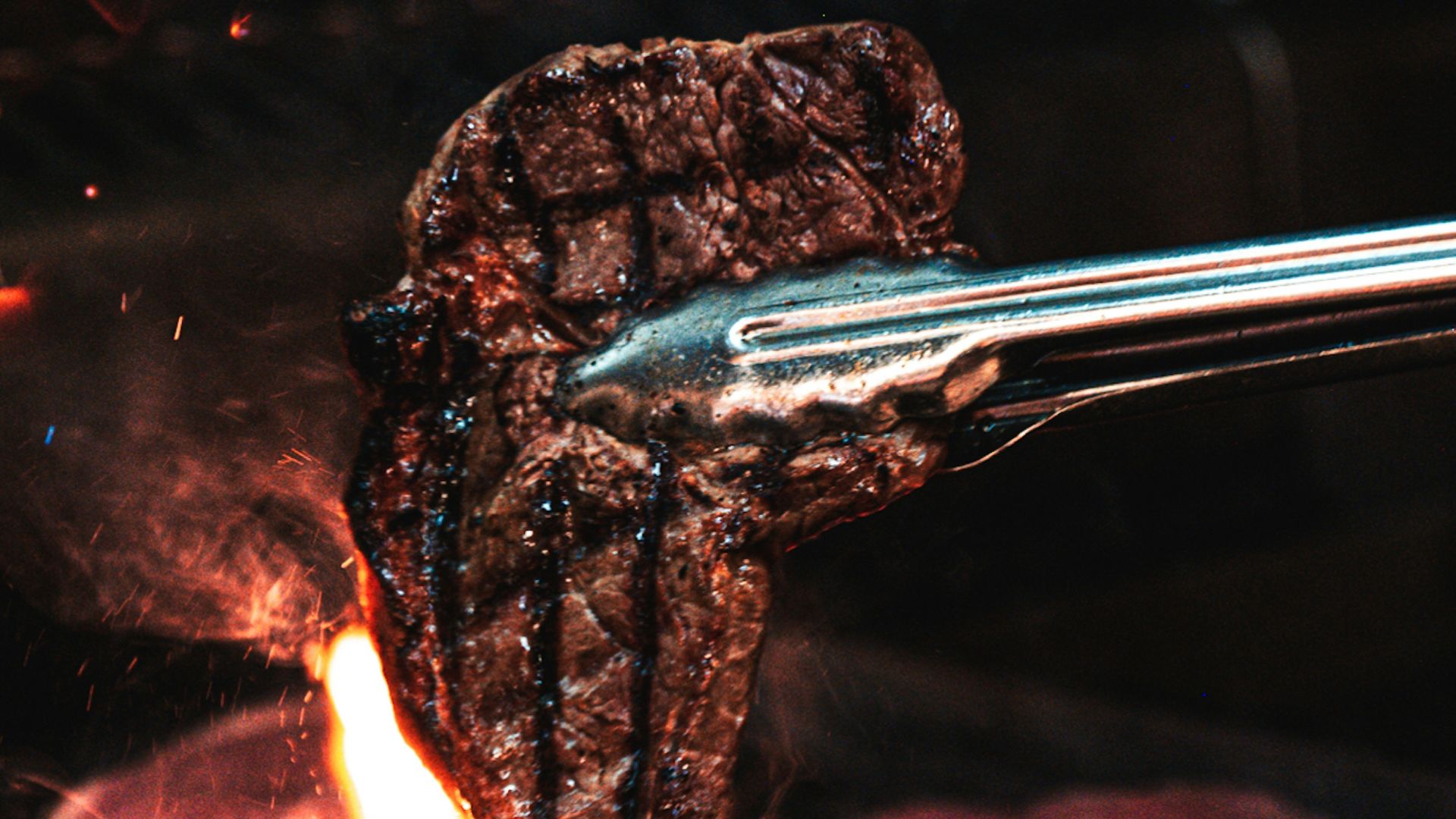 silver fork on fire during night time