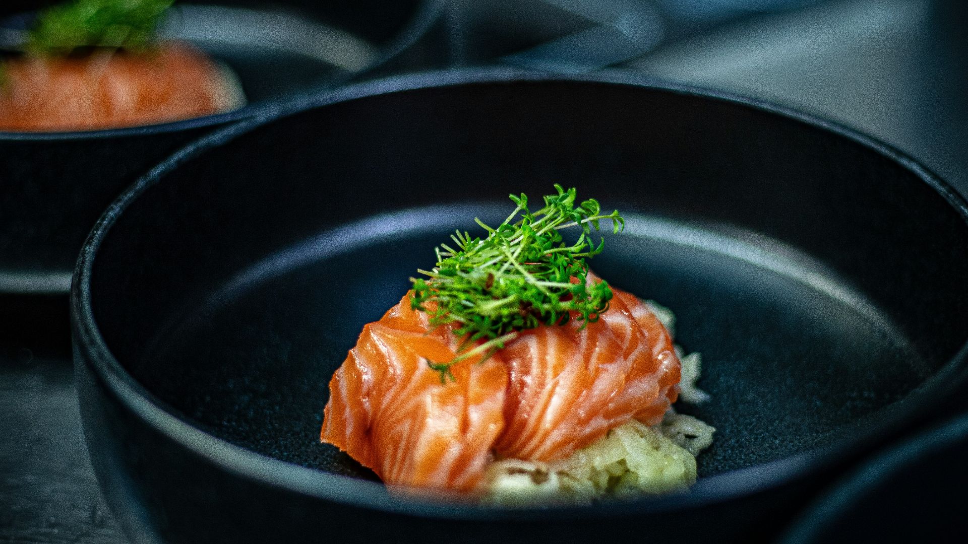 a black plate with some food in it