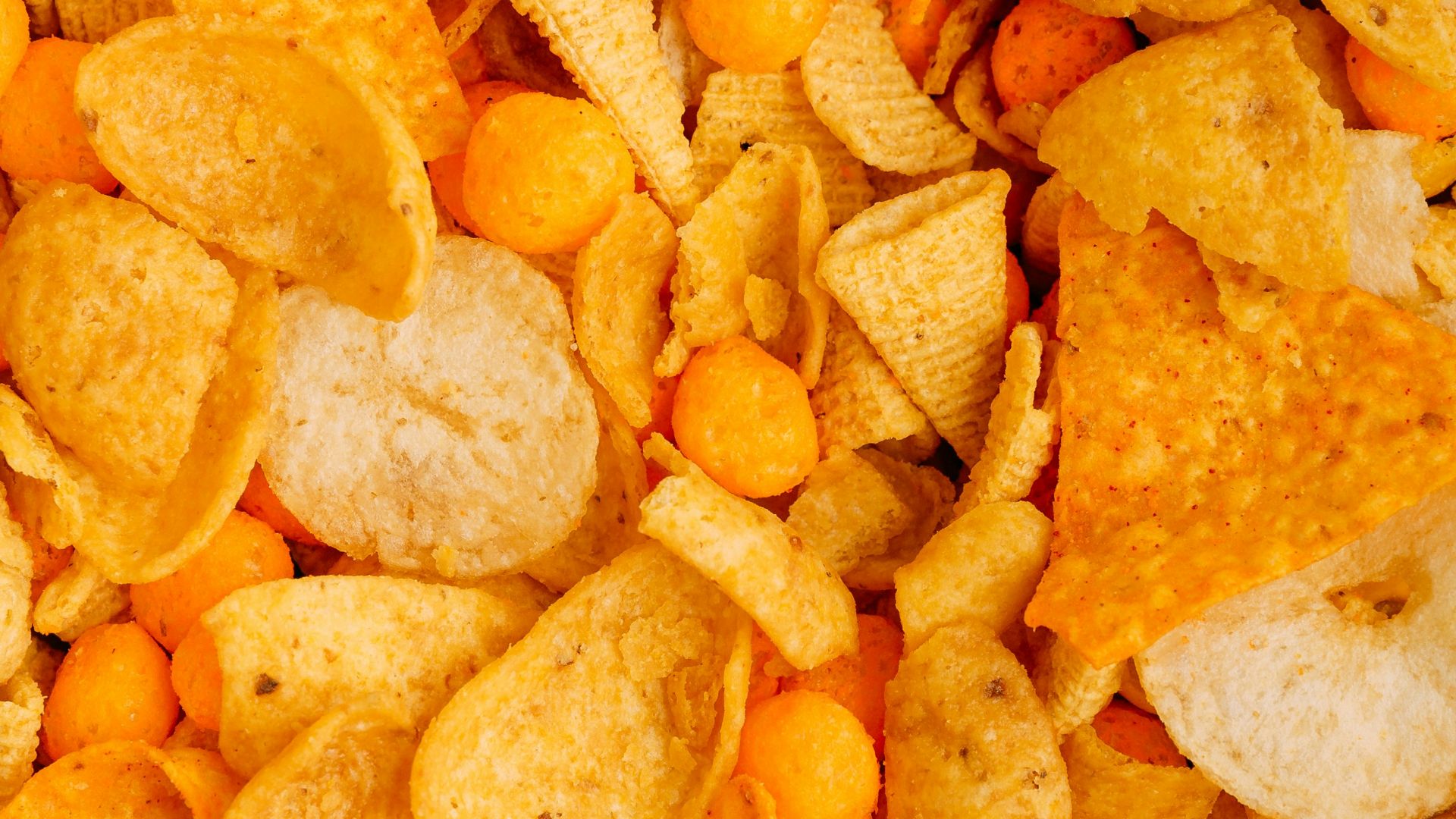 a close up of a pile of corn chips