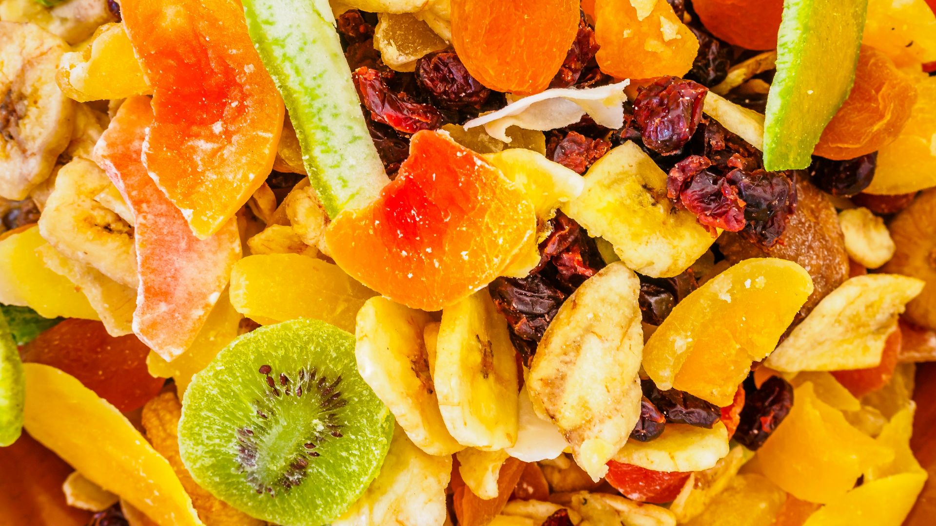 a close up of a mixture of fruit and nuts