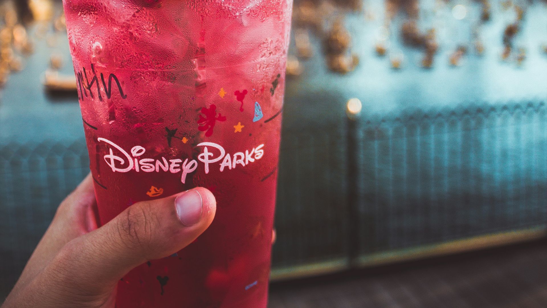pink Disney Paris drink with green straw