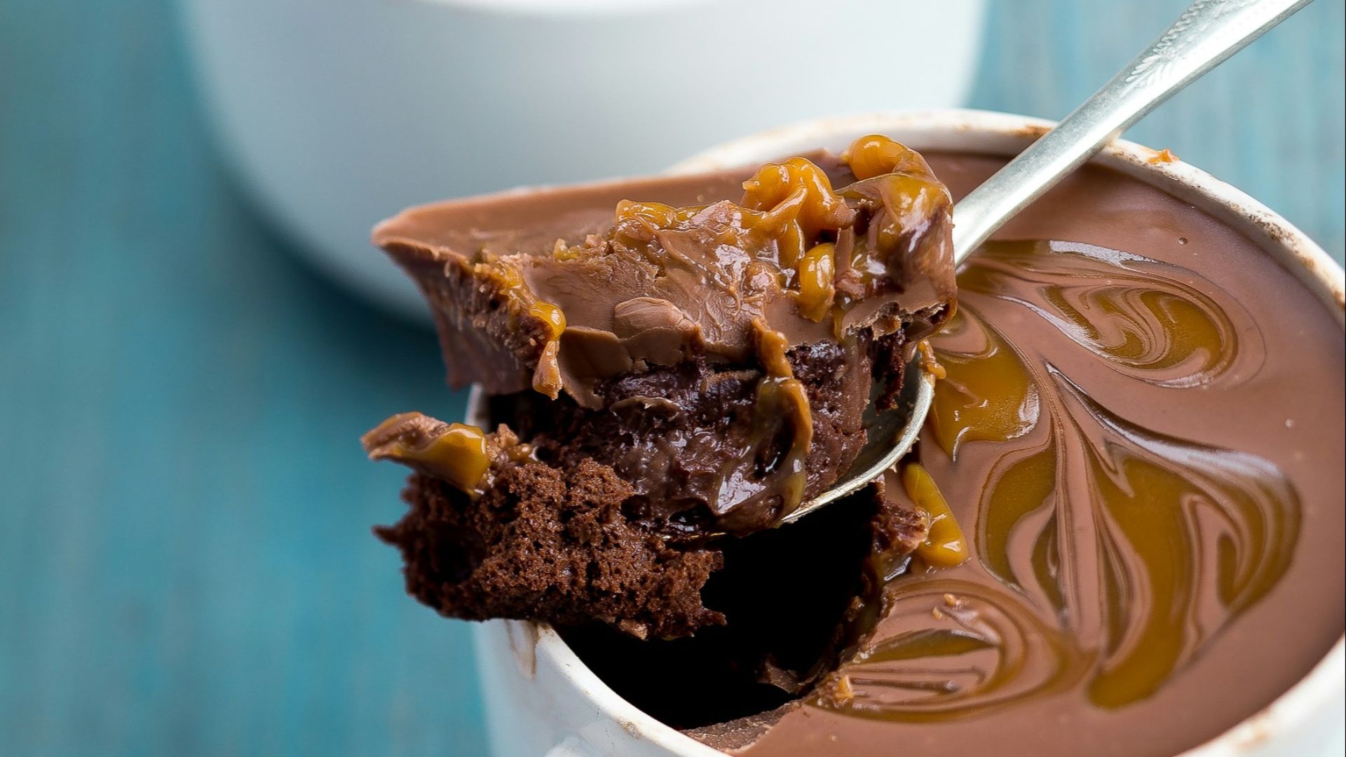 two white ceramic mug with chocolate truffles