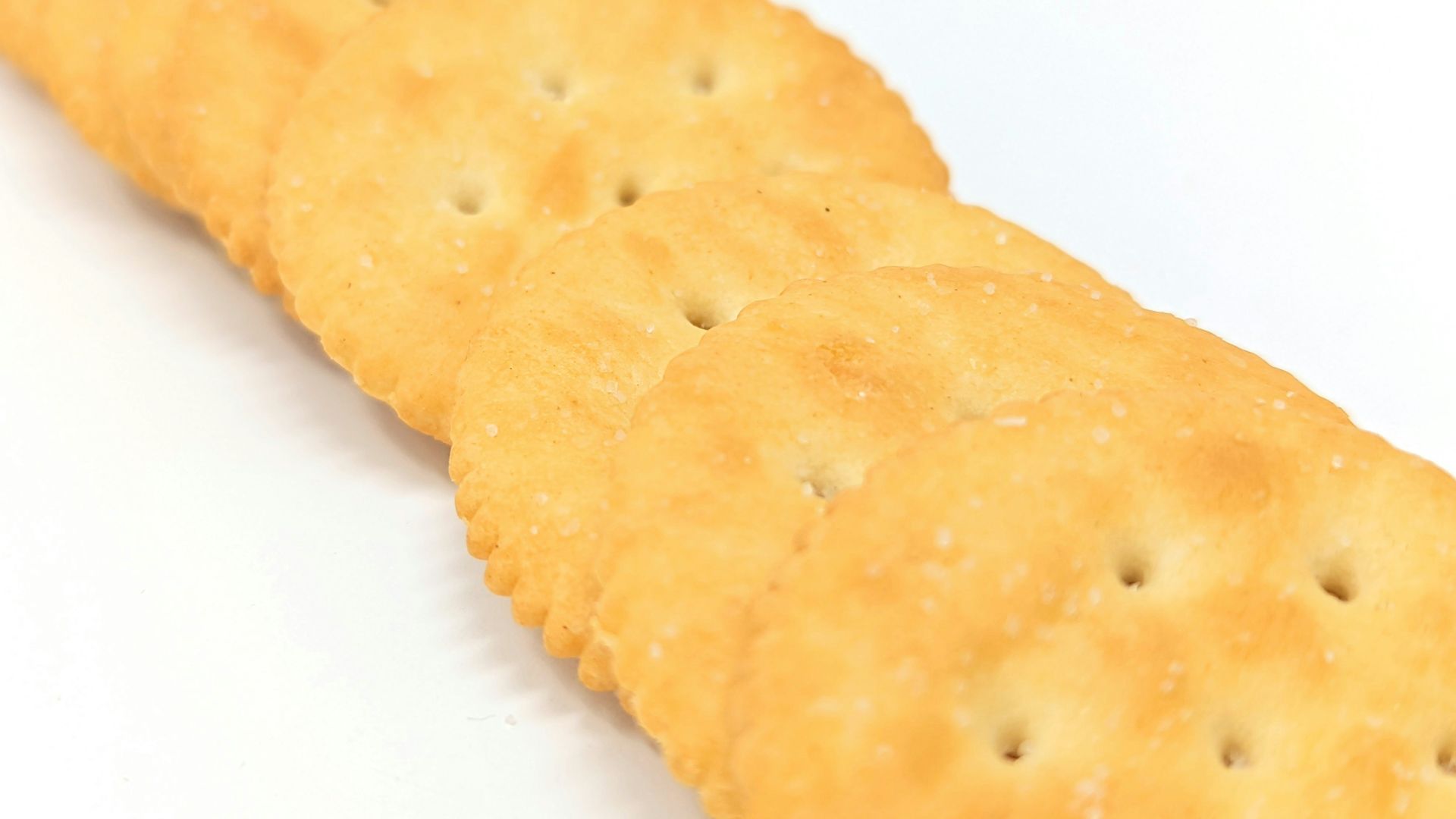 a close up of a cracker on a white surface