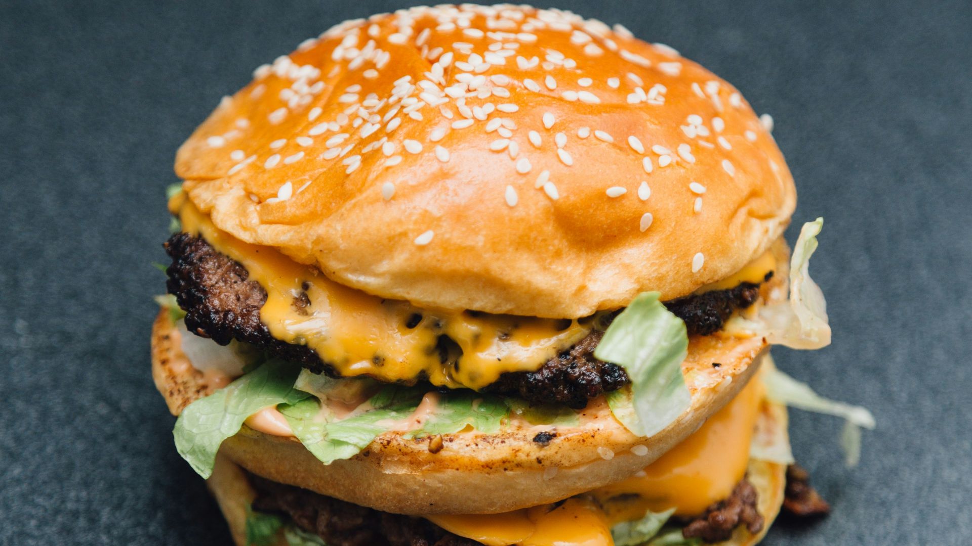 A hamburger sitting on top of a table