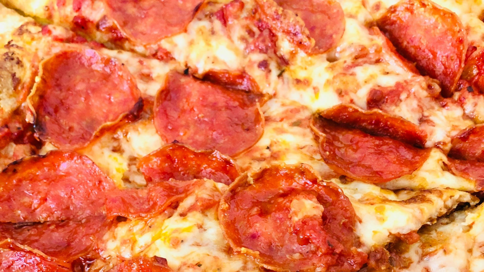 pepperoni pizza on white ceramic plate