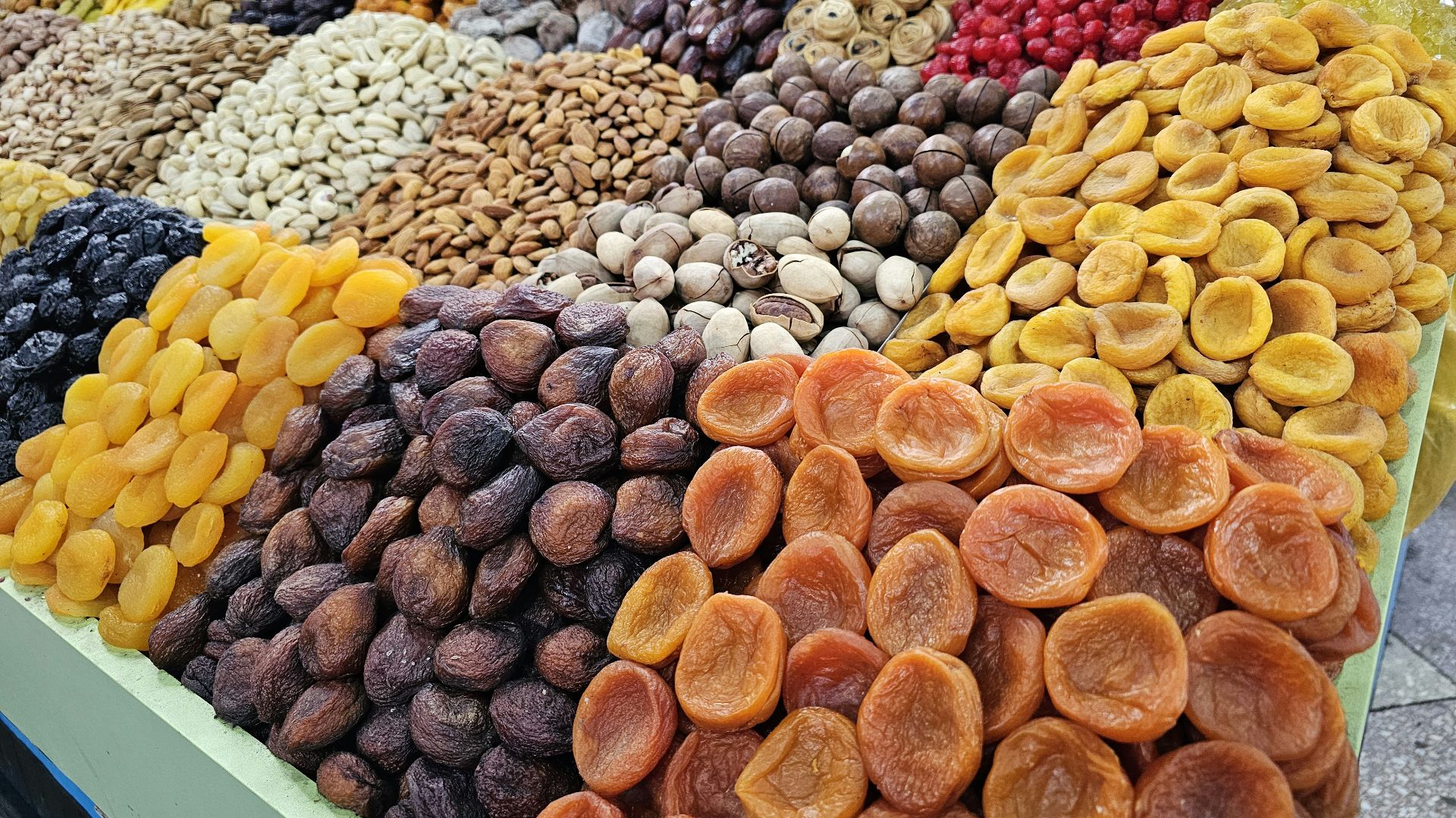 a display of dried fruits and nuts for sale