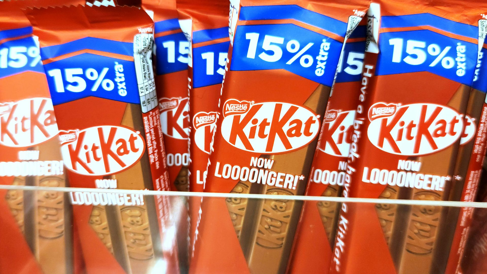 Kit kat chocolate bars are displayed for sale.