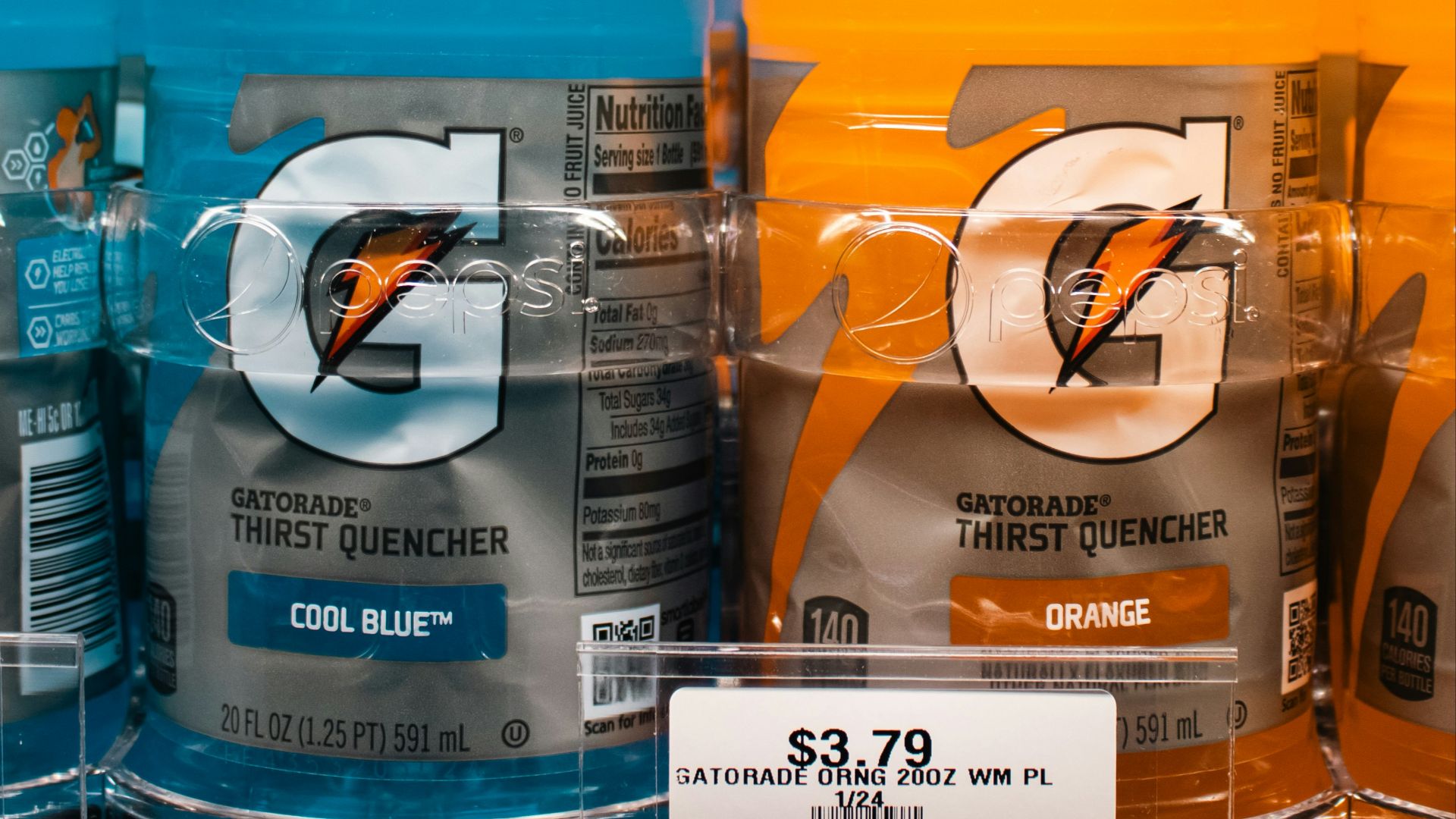 Gatorade bottles are displayed on a store shelf.