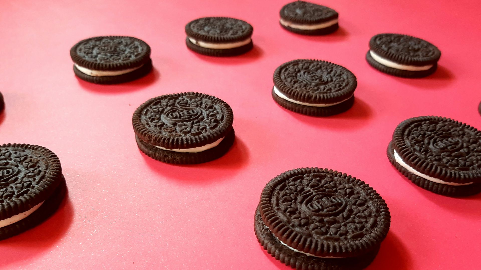 black round coin on pink surface