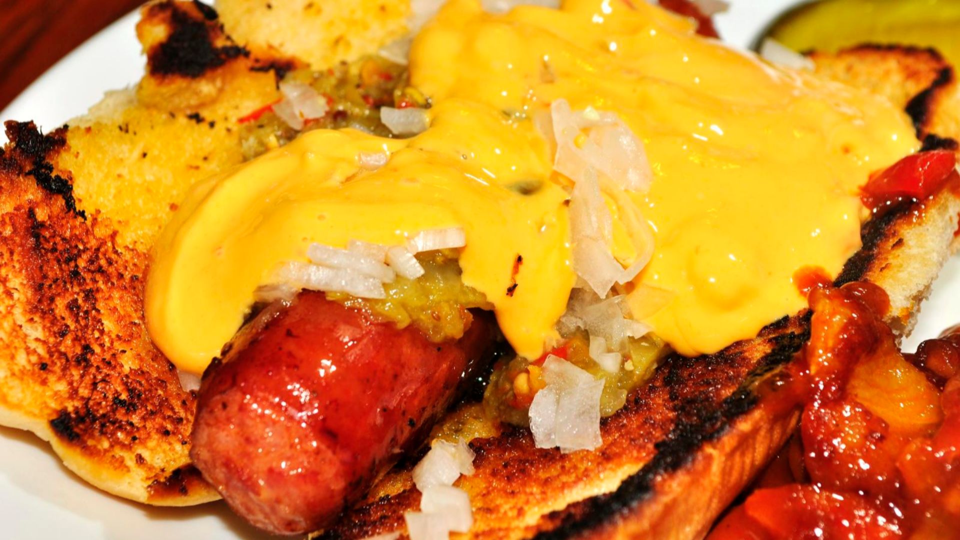 File:Hot dog with cheese sauce.jpg